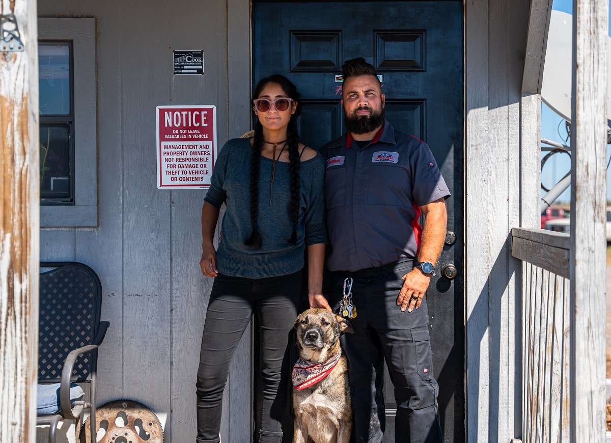 Looks like a solid team! The person on the right is wearing a mechanic's uniform, possibly from Phantom Auto Repair.
